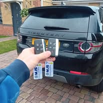 2 x Landrover Discovery Sport keys programmed on customers driveway showing 2 keys and a black car