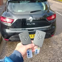 Black Renault Clio with 2 x remote key cards programmed on site with MJS Auto Locksmith key tags attached