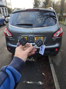 3 Spre keys cut and programmed for 2021 Nissan Qashqai showing MJS key tag and grey car