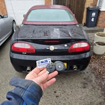 Mobile call out to customers home in Stanley showing MG car and new key and remote fob being held up.